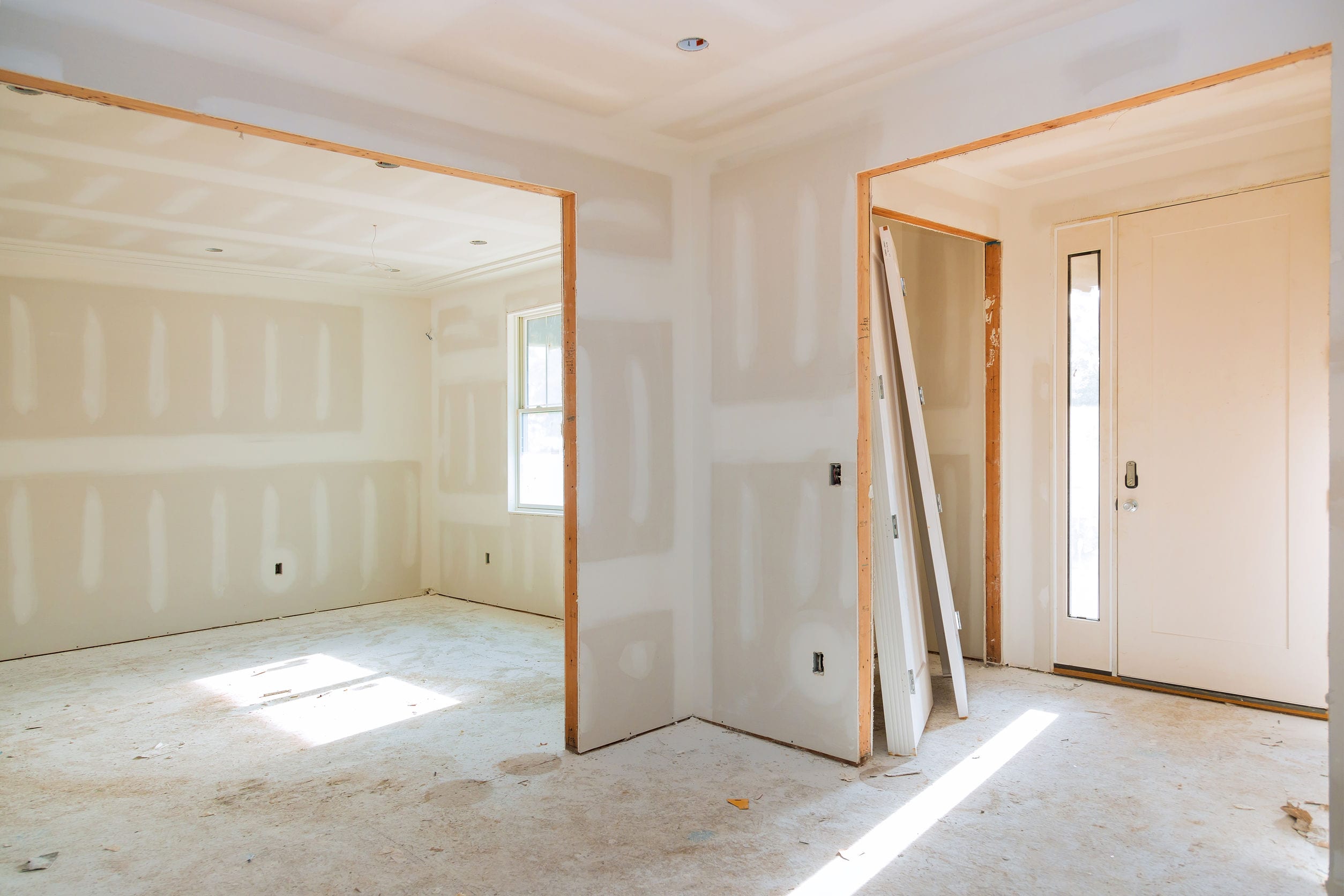 Construction building industry new home construction interior drywall tape and finish details installed door for a new home before installing